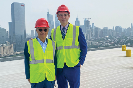 James Kin with Penn Neurosurgery Chair Daniel Yoshor on the roof of the Pavilion
